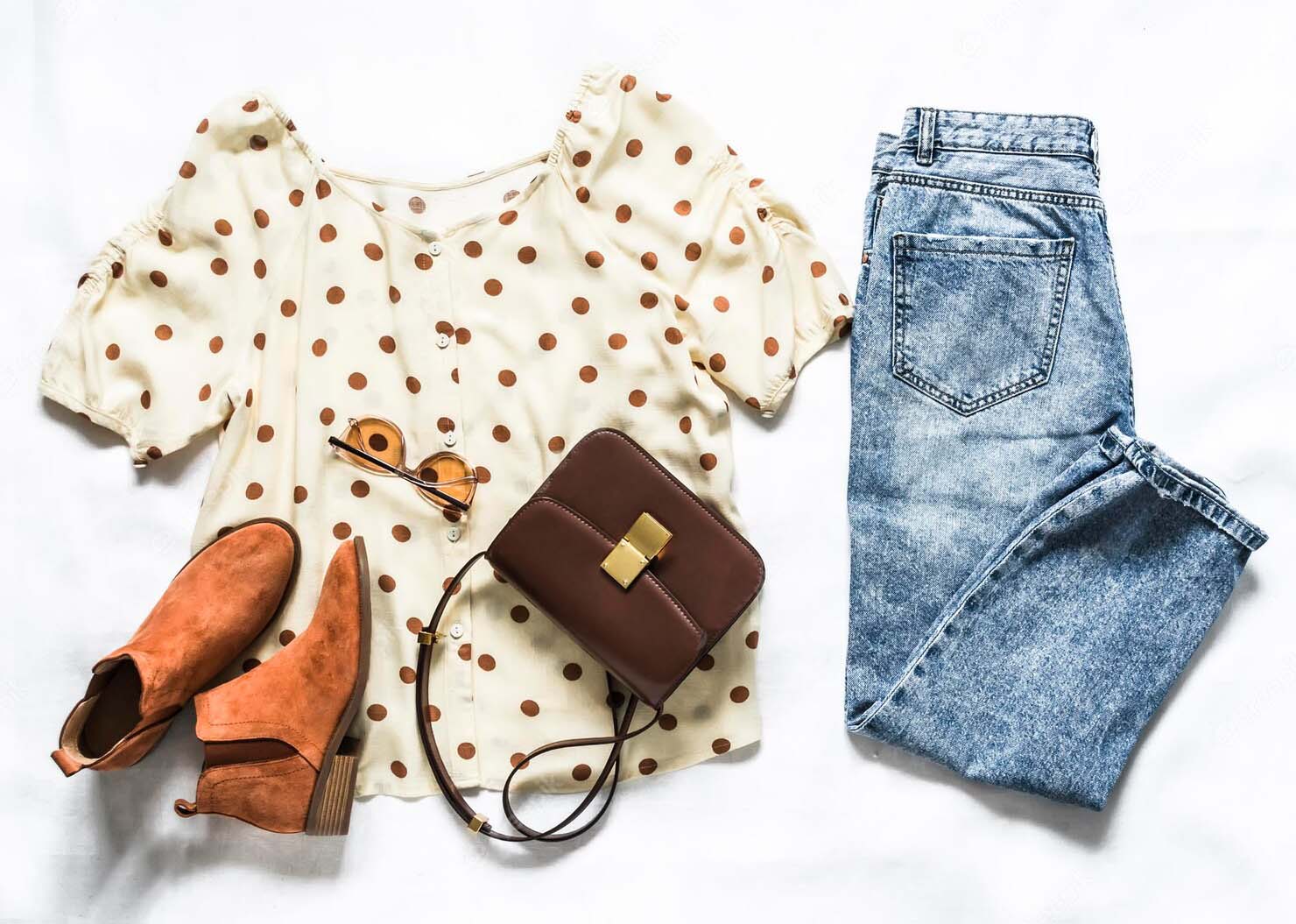 set-women-s-summer-clothes-blue-mom-jeans-polka-dot-blouse-chelsea-boots-cross-body-bag-light-background-top-view
